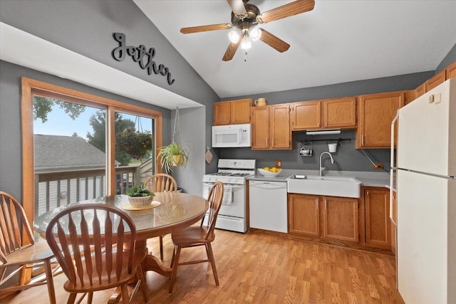 3583 Newport Dr, Island Lake, IL 60042 - kitchen featuring white appliances, lofted ceiling, light countertops, light wood-style floors, and a ceiling fan