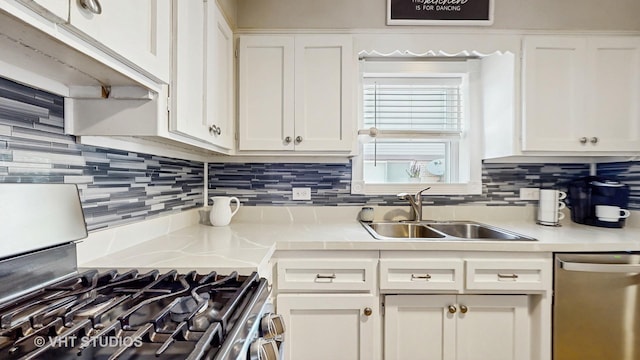 7525 N Overhill Ave, Chicago, IL 60631 - kitchen with appliances with stainless steel finishes, light countertops, white cabinetry, and tasteful backsplash