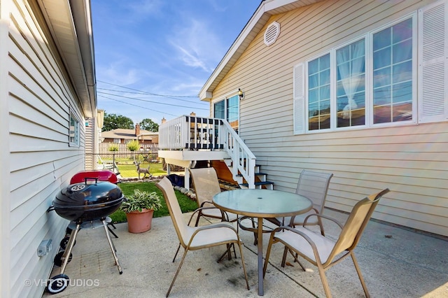 7525 N Overhill Ave, Chicago, IL 60631 - view of patio with area for grilling, outdoor dining area, and stairway