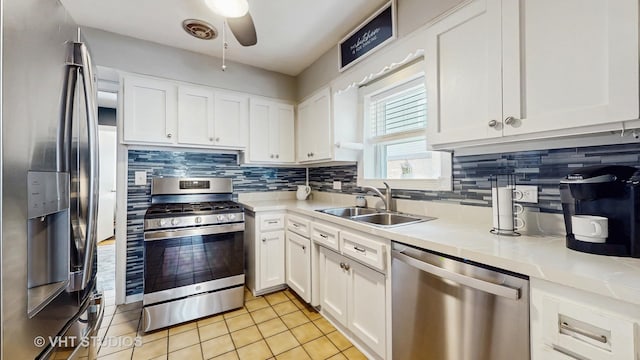 7525 N Overhill Ave, Chicago, IL 60631 - kitchen with stainless steel appliances, ceiling fan, backsplash, light tile patterned floors, and light countertops