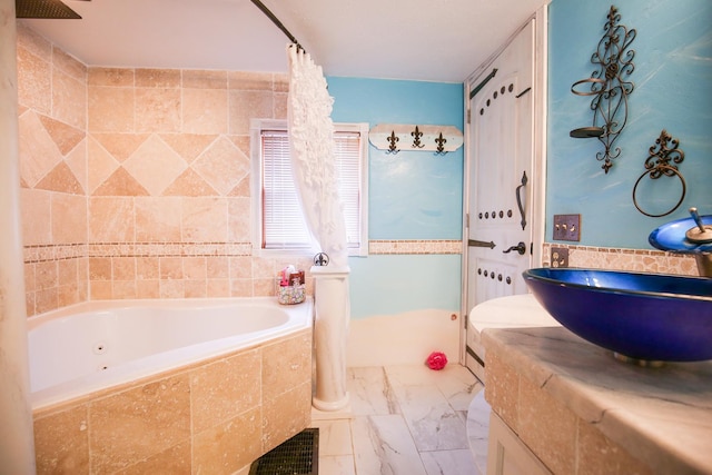 382 Keigwin Rd, Walnut, IL 61376 - bathroom with a garden tub, vanity, and marble look tile flooring
