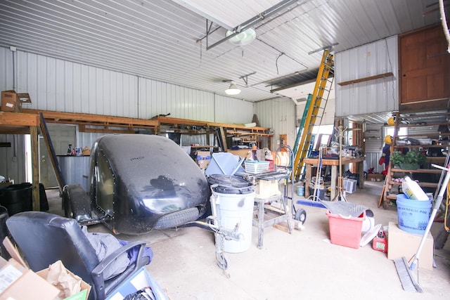 382 Keigwin Rd, Walnut, IL 61376 - garage featuring metal wall and a workshop area