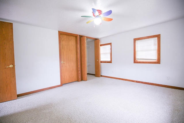 382 Keigwin Rd, Walnut, IL 61376 - unfurnished bedroom with light carpet and ceiling fan