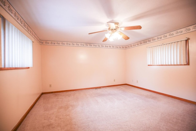 382 Keigwin Rd, Walnut, IL 61376 - empty room featuring light carpet and ceiling fan