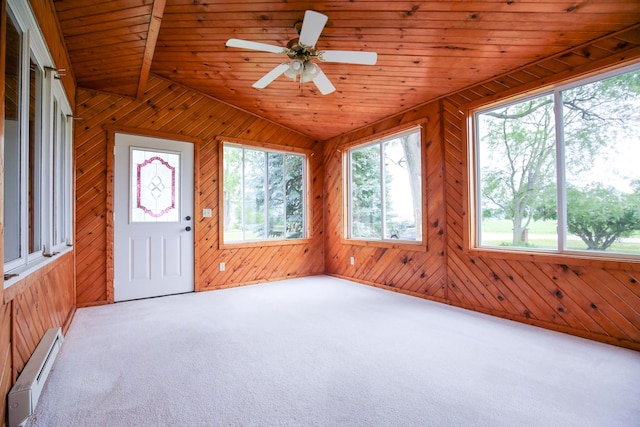 382 Keigwin Rd, Walnut, IL 61376 - unfurnished sunroom with a baseboard heating unit and vaulted ceiling