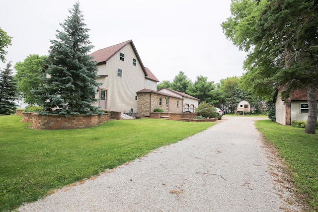 382 Keigwin Rd, Walnut, IL 61376 - view of home's exterior with a lawn and driveway