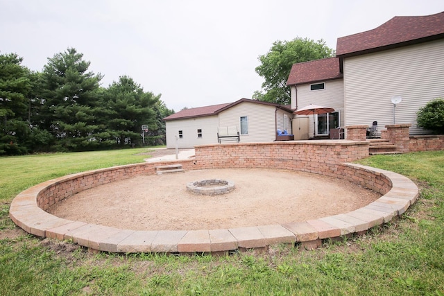382 Keigwin Rd, Walnut, IL 61376 - view of grassy yard featuring a patio and an outdoor fire pit