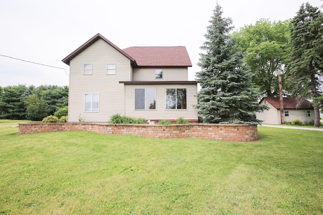 382 Keigwin Rd, Walnut, IL 61376 - view of front of property featuring a front yard and roof with shingles