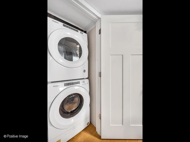 2118 W N Ave Unit Bs, Chicago, IL 60647 - laundry area featuring stacked washing machine and dryer and light wood finished floors
