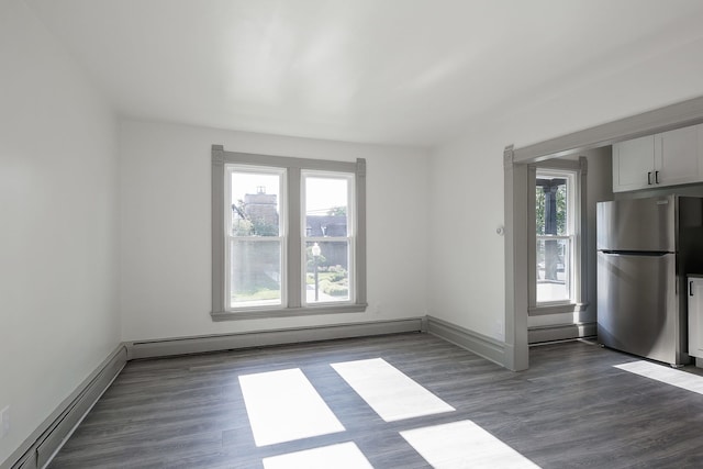 123 N W St, Wheaton, IL 60187 - unfurnished room featuring baseboard heating, a baseboard radiator, and dark wood-style floors