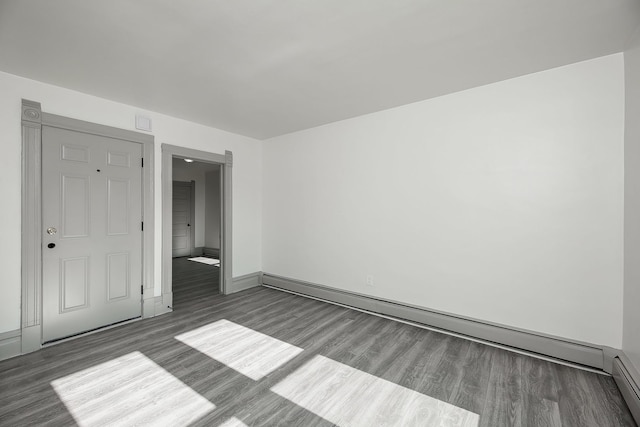 123 N W St, Wheaton, IL 60187 - unfurnished room with wood finished floors, baseboard heating, and a baseboard heating unit