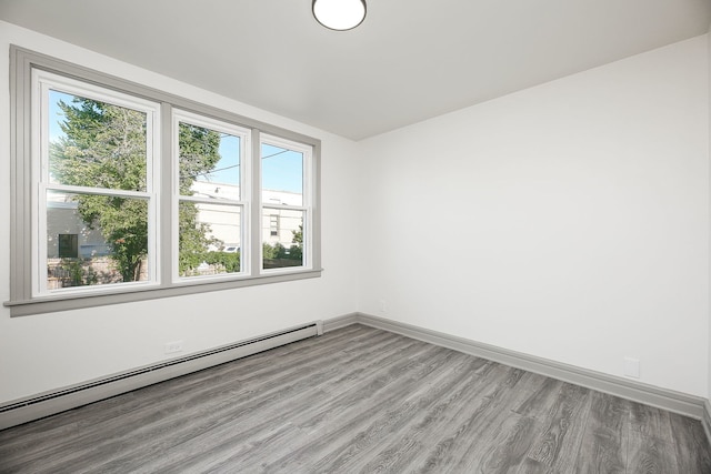 123 N W St, Wheaton, IL 60187 - unfurnished room featuring a baseboard radiator and light wood finished floors