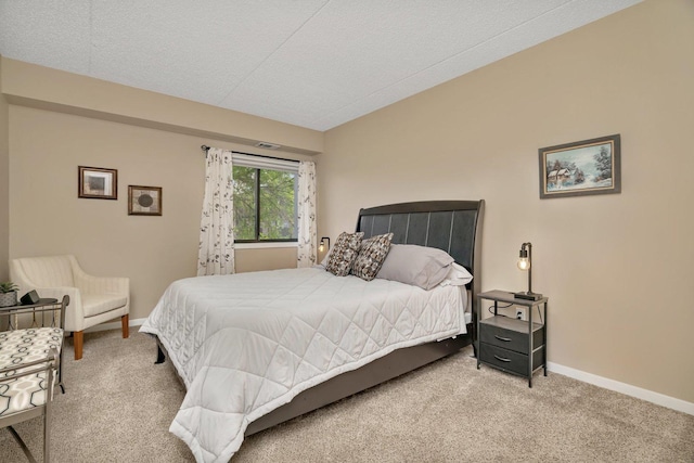 1422 Woodbridge Rd Unit 2E, Joliet, IL 60436 - carpeted bedroom featuring baseboards and a textured ceiling