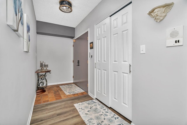 1422 Woodbridge Rd Unit 2E, Joliet, IL 60436 - entrance foyer featuring wood finished floors and a textured ceiling