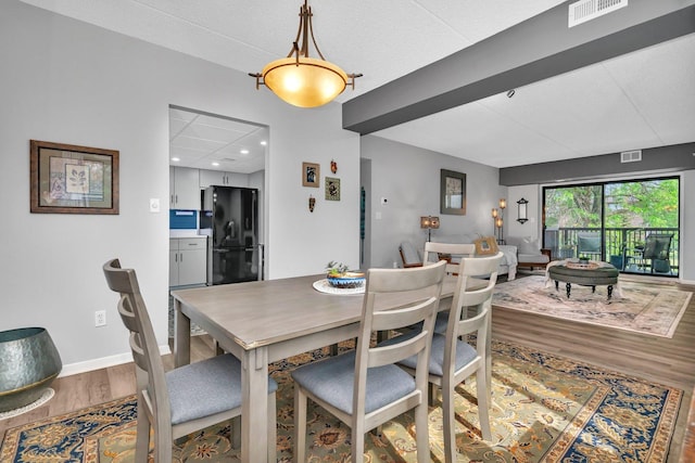 1422 Woodbridge Rd Unit 2E, Joliet, IL 60436 - dining room featuring wood finished floors and recessed lighting