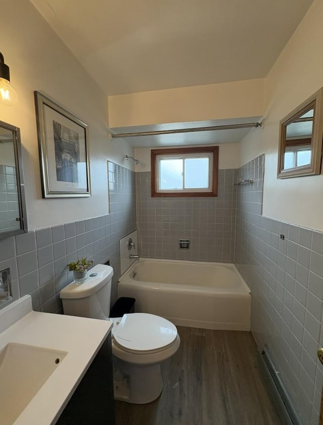 1205 N Harlem Ave Unit 6, Oak Park, IL 60302 - full bath featuring tile walls, shower / tub combination, wood finished floors, vanity, and a wainscoted wall