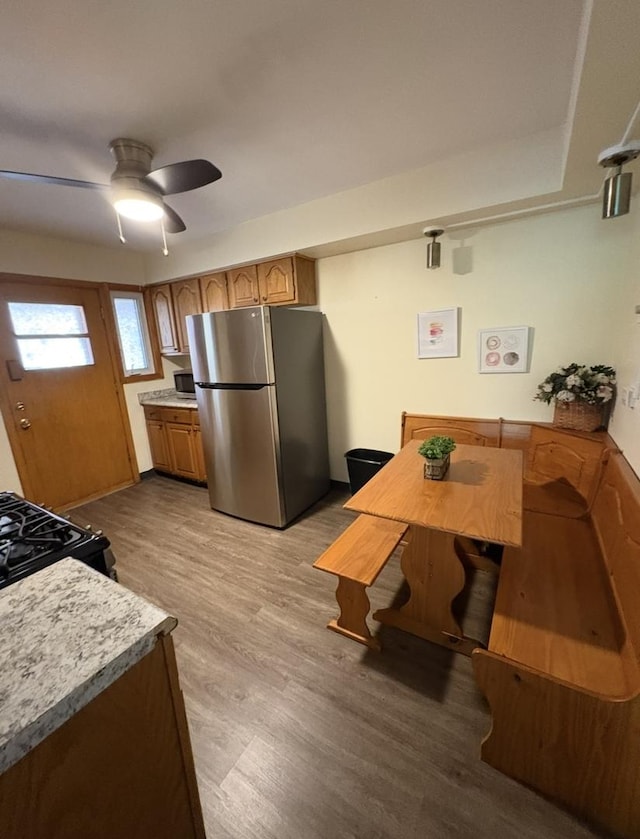 1205 N Harlem Ave Unit 6, Oak Park, IL 60302 - kitchen with freestanding refrigerator, light countertops, a ceiling fan, light wood-type flooring, and black gas range oven