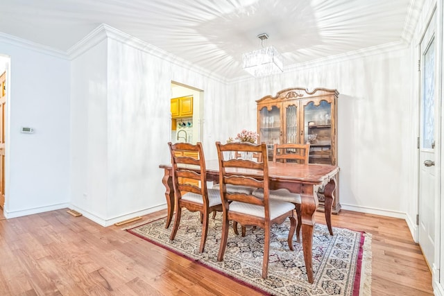817 Hibbard Rd Unit D, Wilmette, IL 60091 - dining room with a chandelier, ornamental molding, and light wood-type flooring