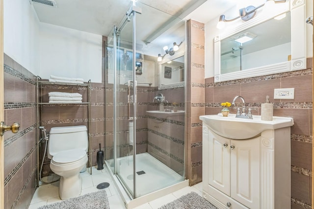 817 Hibbard Rd Unit D, Wilmette, IL 60091 - full bathroom with tile walls, tile patterned flooring, a stall shower, and vanity