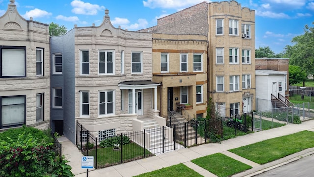 4047 W Adams St, Chicago, IL 60624 - view of front of property featuring a fenced front yard and stone siding