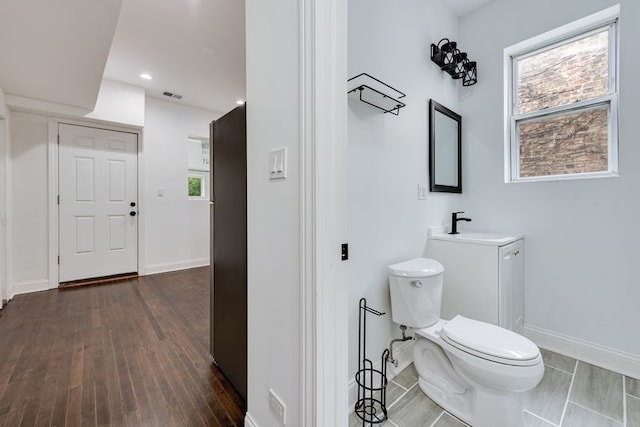 4047 W Adams St, Chicago, IL 60624 - bathroom featuring vanity, wood finished floors, and recessed lighting