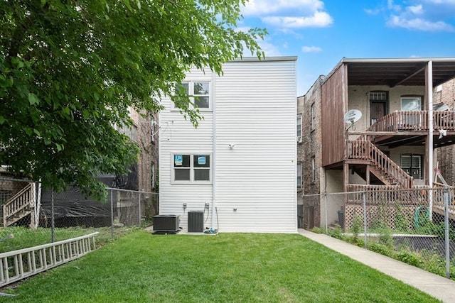 4047 W Adams St, Chicago, IL 60624 - rear view of property with a fenced backyard and stairs