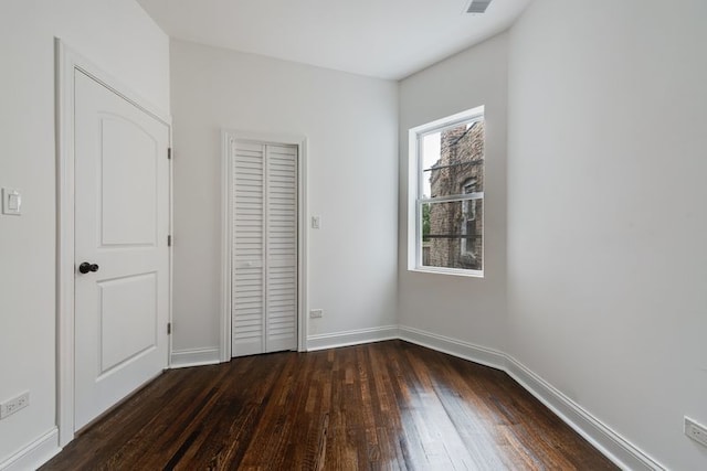 4047 W Adams St, Chicago, IL 60624 - unfurnished bedroom with dark wood finished floors and a closet