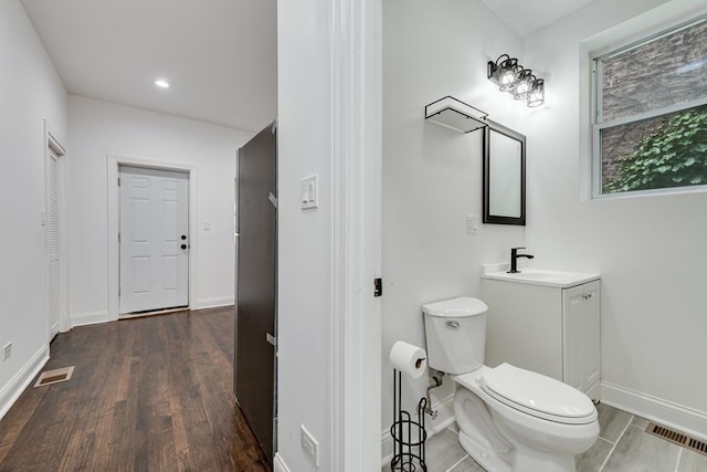 4047 W Adams St, Chicago, IL 60624 - bathroom featuring vanity, wood finished floors, and recessed lighting