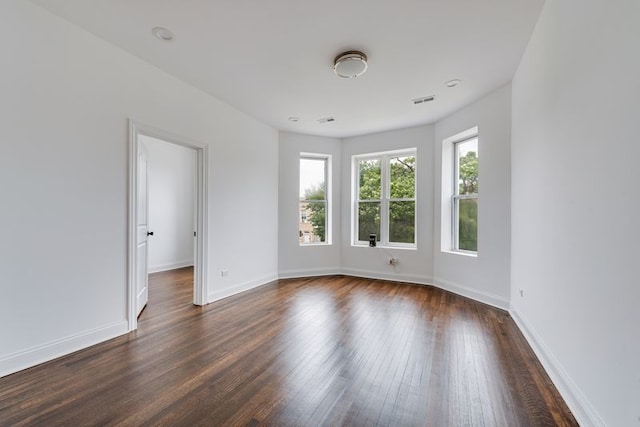 4047 W Adams St, Chicago, IL 60624 - empty room featuring dark wood-type flooring and baseboards