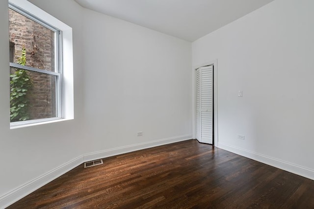 4047 W Adams St, Chicago, IL 60624 - empty room featuring dark wood-style floors and baseboards