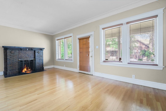 7545 S Ridgeland Ave, Chicago, IL 60649 - unfurnished living room with wood finished floors, a brick fireplace, and ornamental molding