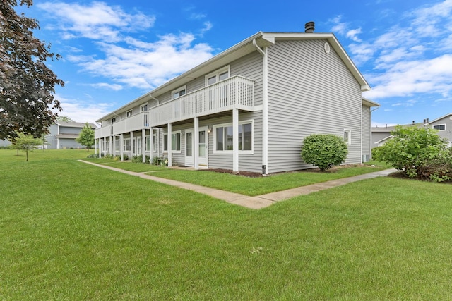 17525 W Walnut Ln, Gurnee, IL 60031 - back of house with a yard and a balcony