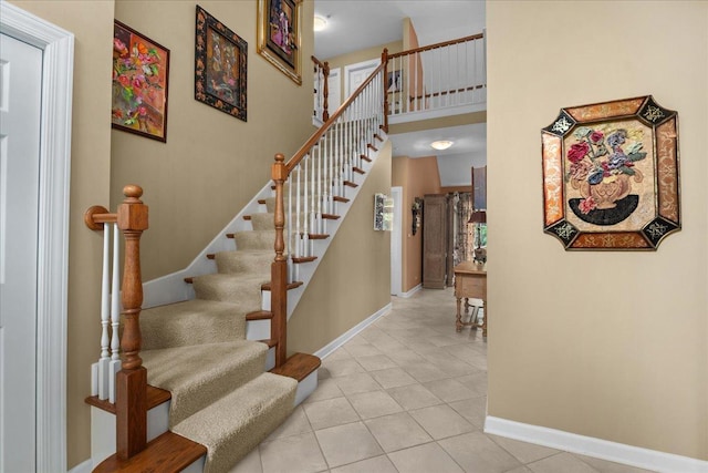 850 Evergreen Way, Highland Park, IL 60035 - stairway featuring tile patterned floors and a towering ceiling