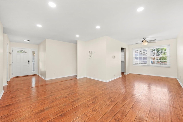 13659 W Cedarbend Dr, Homer Glen, IL 60491 - unfurnished living room featuring light wood-type flooring, a ceiling fan, and recessed lighting