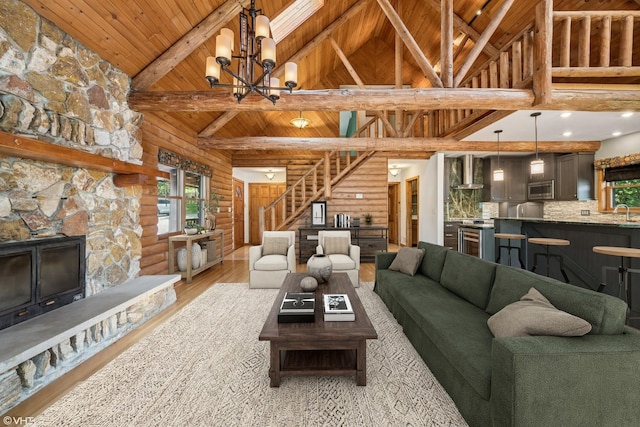 723 N River Rd, Algonquin, IL 60102 - living room with log walls, a wooden ceiling with exposed beams, wood finished floors, stairway, and high vaulted ceiling