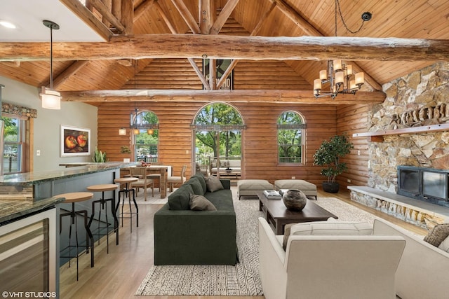 723 N River Rd, Algonquin, IL 60102 - living room with a wood ceiling with exposed beams, wine cooler, high vaulted ceiling, rustic walls, and a fireplace