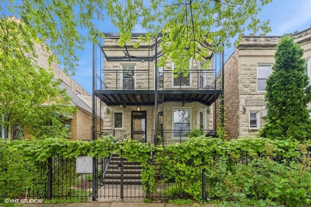 1133 N Spaulding Ave, Chicago, IL 60651 - view of front of property with a balcony and stone siding