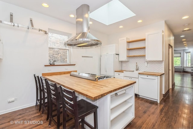1133 N Spaulding Ave, Chicago, IL 60651 - kitchen with open shelves, butcher block countertops, white appliances, island range hood, and recessed lighting
