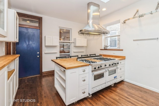 1133 N Spaulding Ave, Chicago, IL 60651 - kitchen with butcher block counters, double oven range, island range hood, open shelves, and recessed lighting