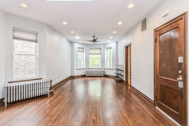 1133 N Spaulding Ave, Chicago, IL 60651 - empty room featuring radiator, wood finished floors, recessed lighting, and a ceiling fan