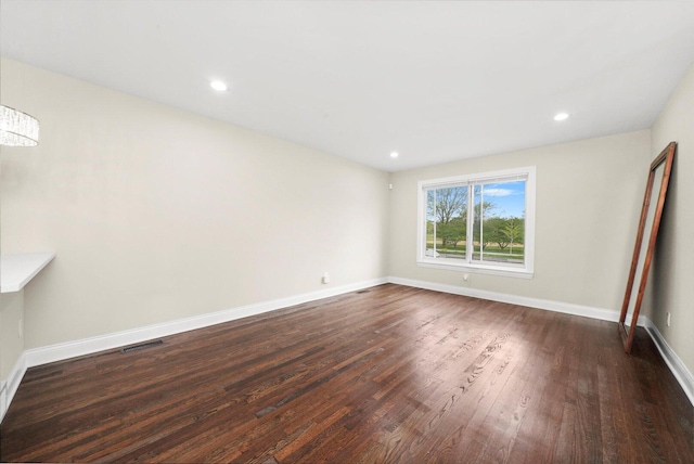 457 E 91st St, Chicago, IL 60619 - spare room with dark wood-type flooring and recessed lighting