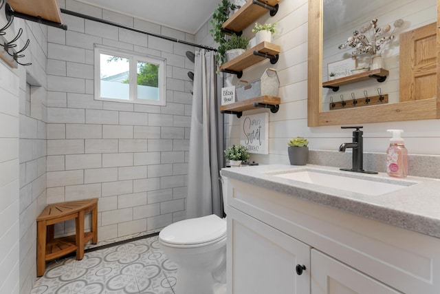 525 Palmer Ave, Aurora, IL 60506 - bathroom featuring vanity, a tile shower, and tile walls