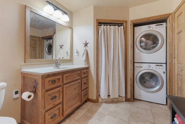 525 Palmer Ave, Aurora, IL 60506 - bathroom with stacked washer / dryer, vanity, tile patterned floors, and a shower with shower curtain