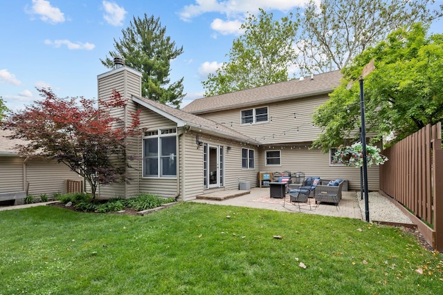 525 Palmer Ave, Aurora, IL 60506 - back of house featuring an outdoor hangout area, a patio area, and a chimney