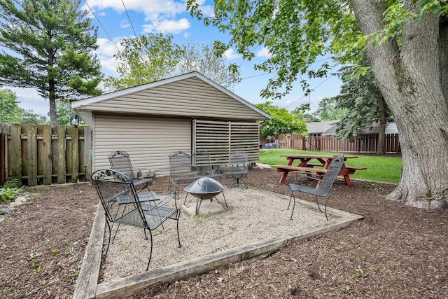 525 Palmer Ave, Aurora, IL 60506 - fenced backyard featuring a patio area and an outdoor fire pit