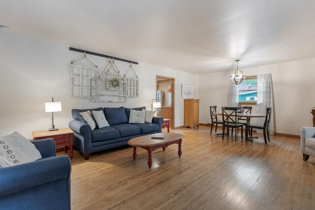 525 Palmer Ave, Aurora, IL 60506 - living area featuring light wood-type flooring and a chandelier