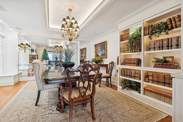 219 E Lake Shore Dr Unit 8C, Chicago, IL 60611 - dining space with a chandelier, crown molding, and wood finished floors