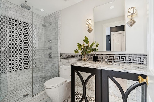 219 E Lake Shore Dr Unit 8C, Chicago, IL 60611 - full bathroom featuring a shower stall, vanity, tile walls, and recessed lighting