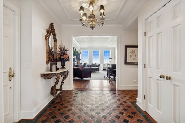 219 E Lake Shore Dr Unit 8C, Chicago, IL 60611 - entrance foyer featuring a chandelier, ornamental molding, and dark flooring