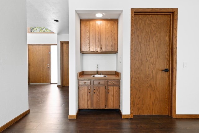 5357 Winding Creek Dr Unit 5357, Rockford, IL 61114 - kitchen with brown cabinets and dark wood-style flooring